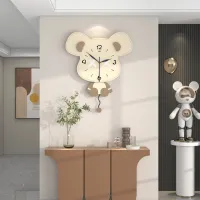 Sleepy Mouse-Shaped Wall Clock with Stitched Ears, Playful Expression, and Dangling Pendulum